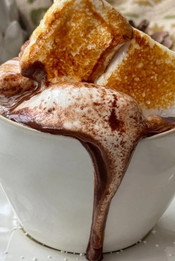 topping french hot chocolate with marshmallows.
