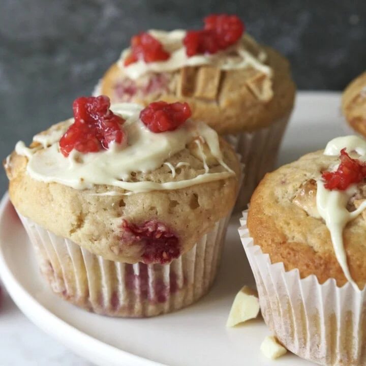 A muffin drizzled with white chocolate.