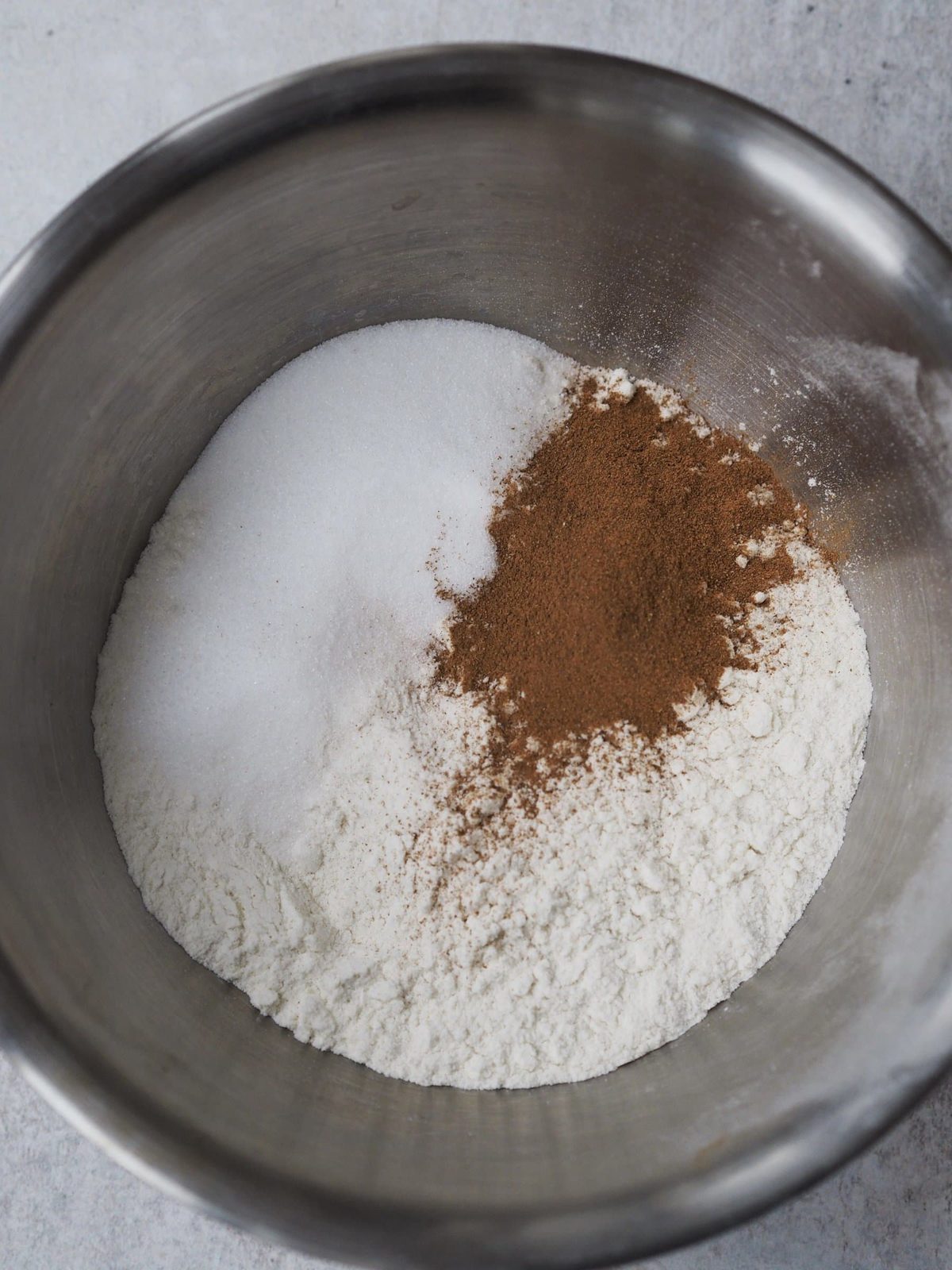 Sugar and ground cinnamon in bowl.