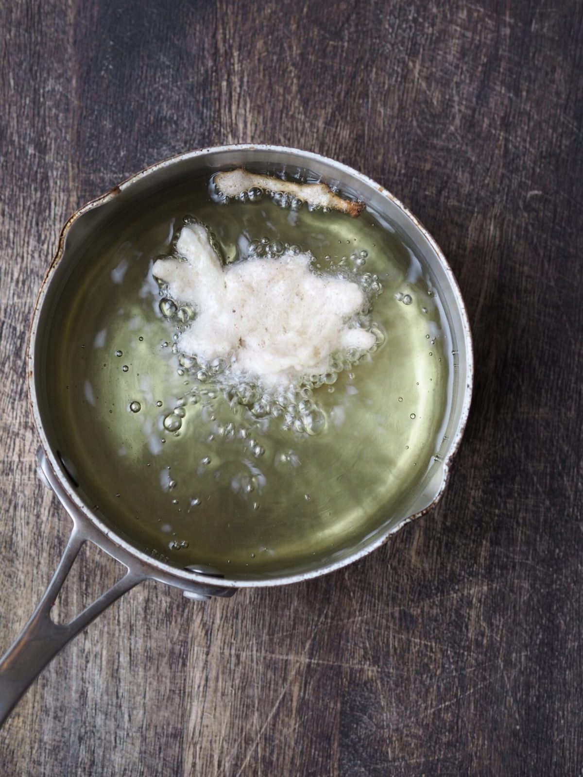 fritter batter to hot oil in a sauce pan.