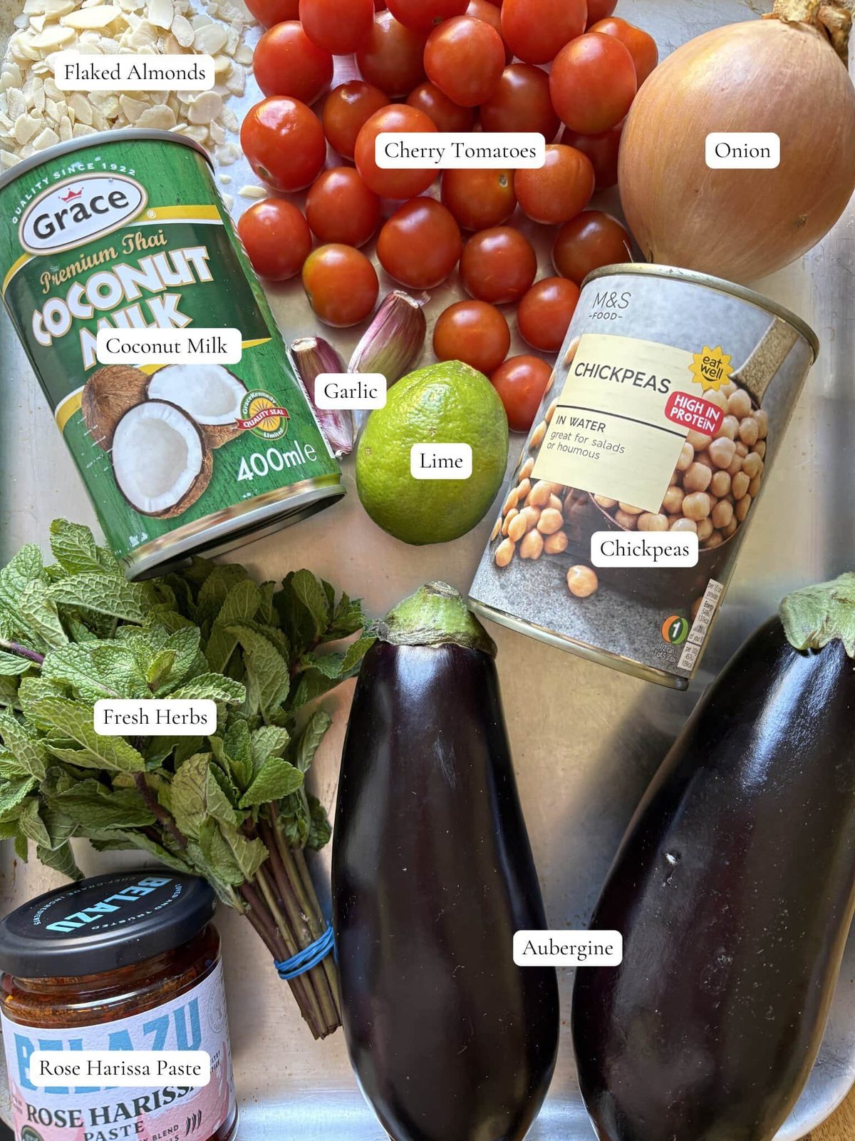 labelled ingredients needed for aubergine curry.