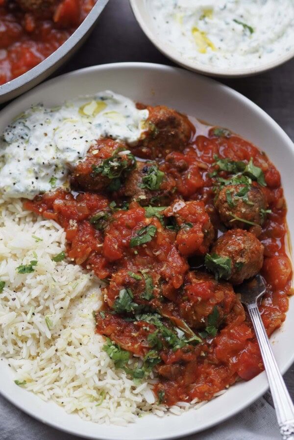 lamb mince meatballs with rice and tomato sauce.