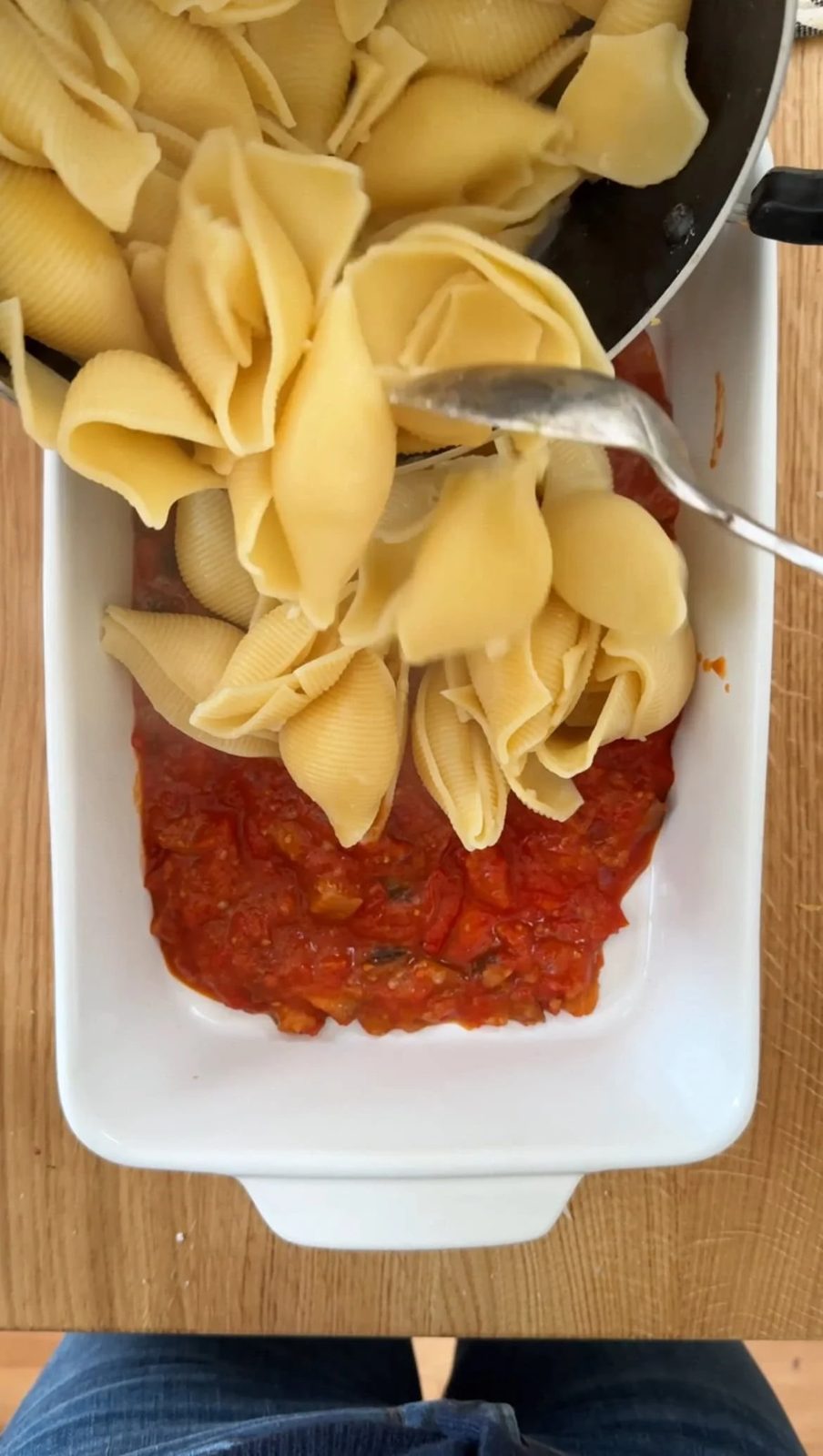layering shells into the dish.