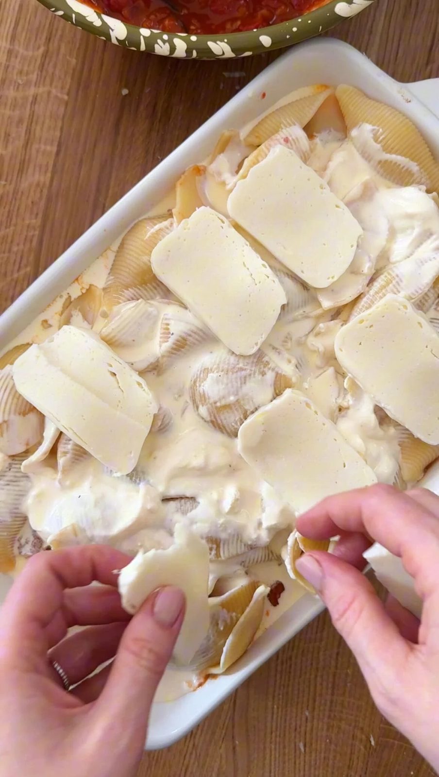 layer with mozzarella and parm before baking.