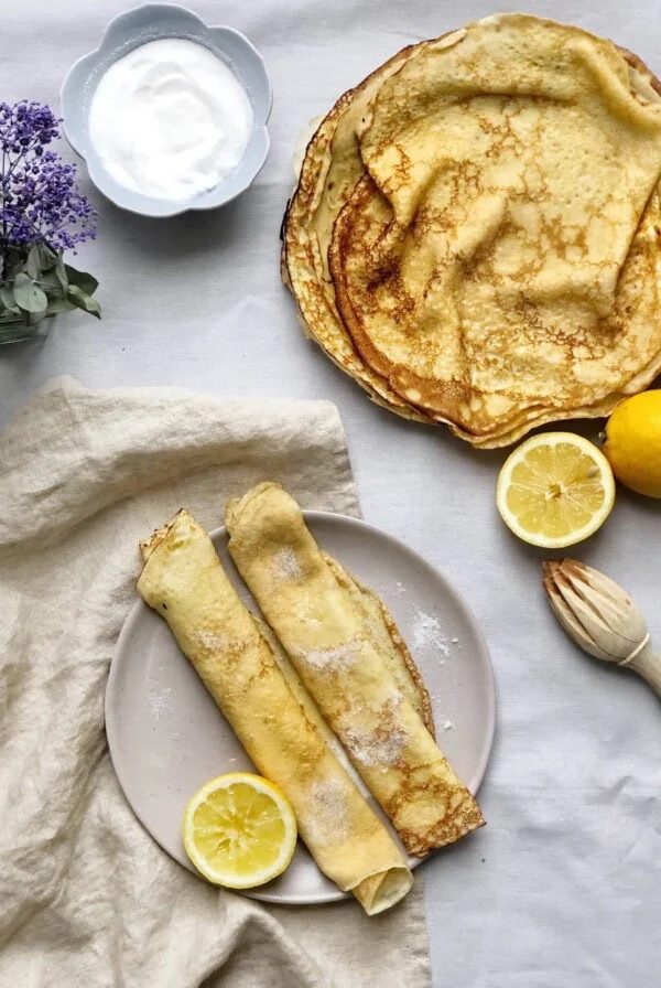 british pancakes on plate with lemon halves
