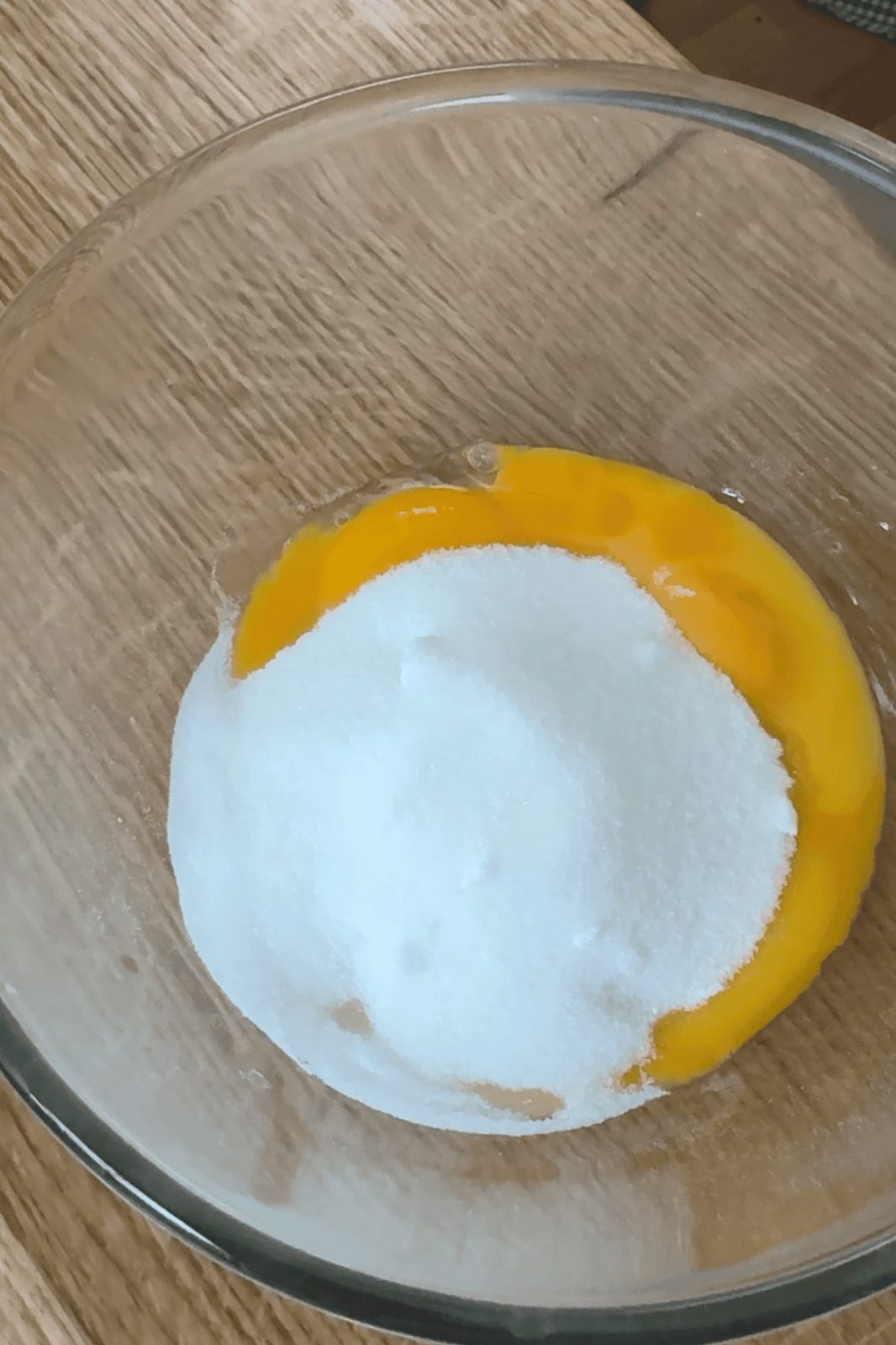whisking sugar and egg yolks.