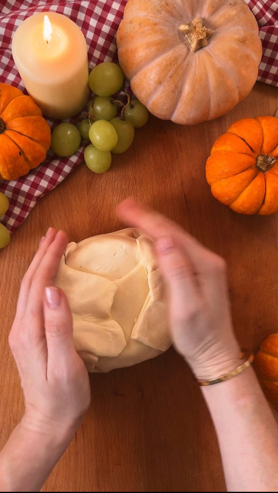 Wrapping puff pastry around the cranberry-topped brie
