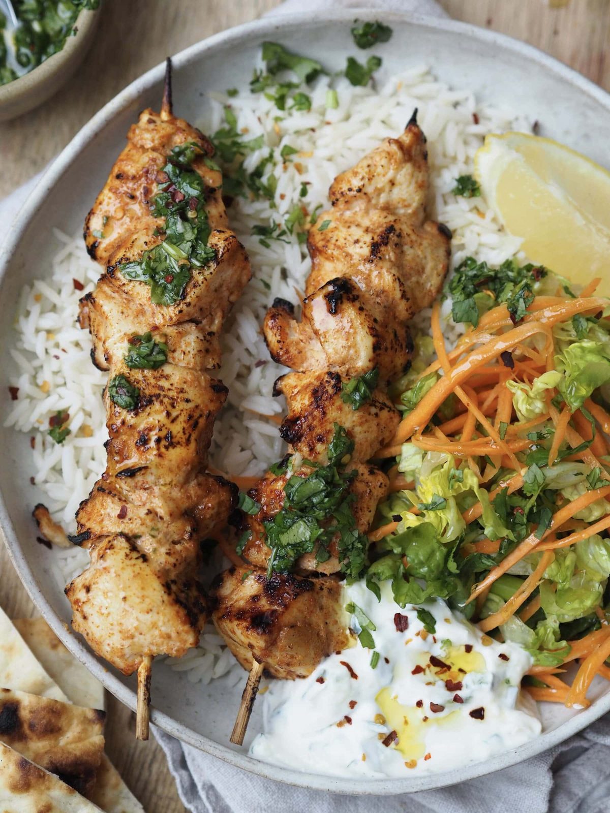 Baked Chicken Skewers with Herb Drizzle, Crunchy Salad & Raita