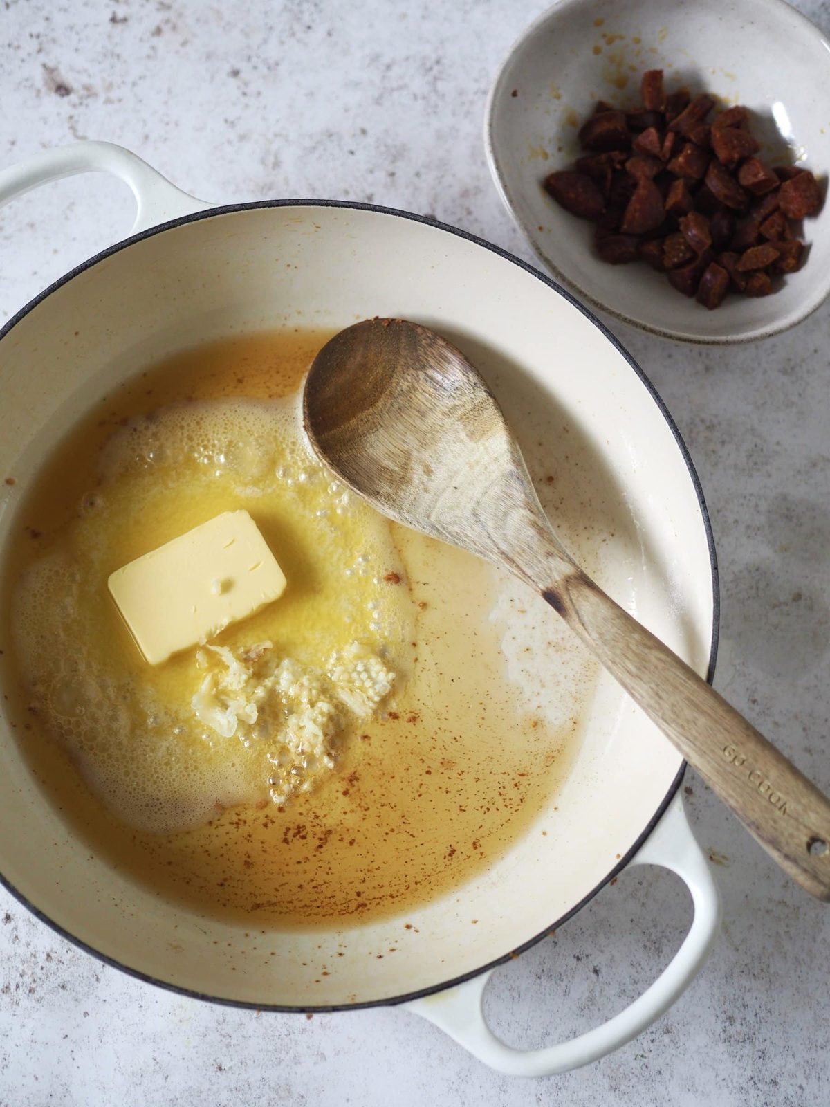 Cooking the chorizo until crisp.