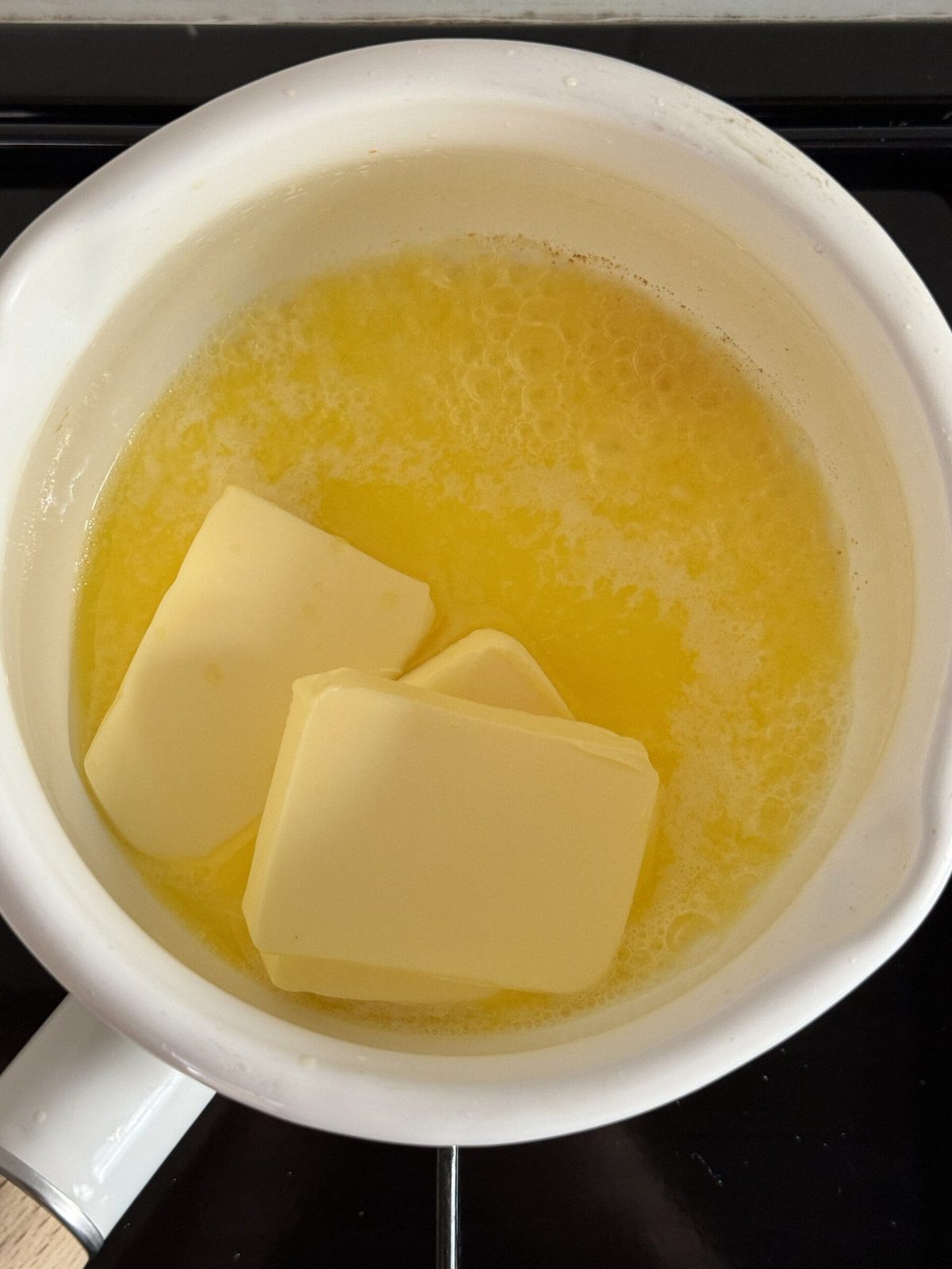Butter melting in small pan.