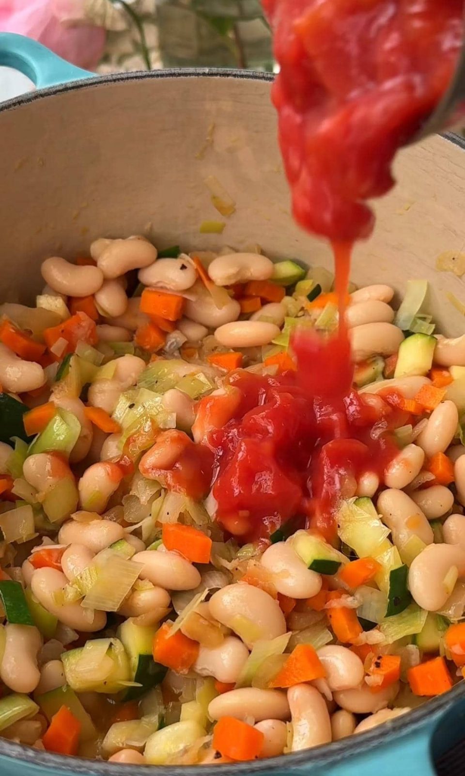 adding tinned tomatoes.
