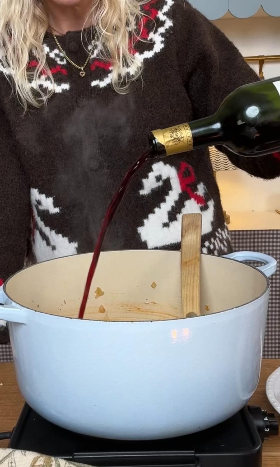 adding red wine to the beef shin ragu.