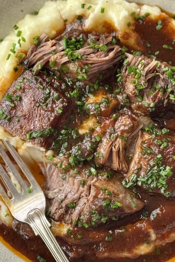 Braised beef short ribs on mashed potato.
