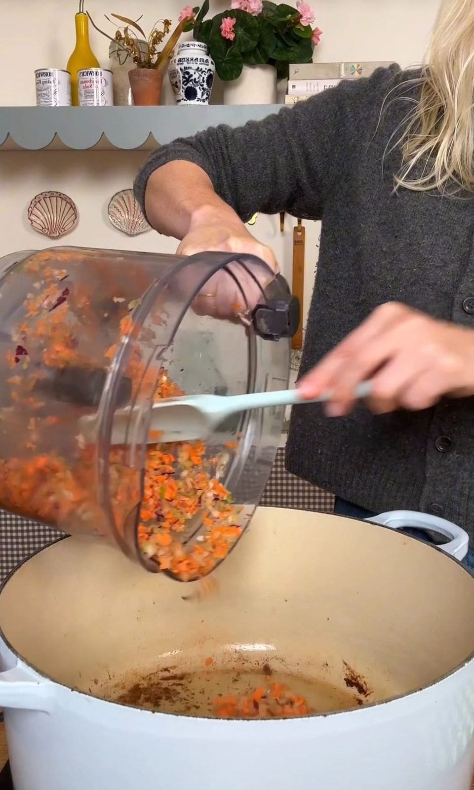 Adding diced soffritto vegetables to the pan.