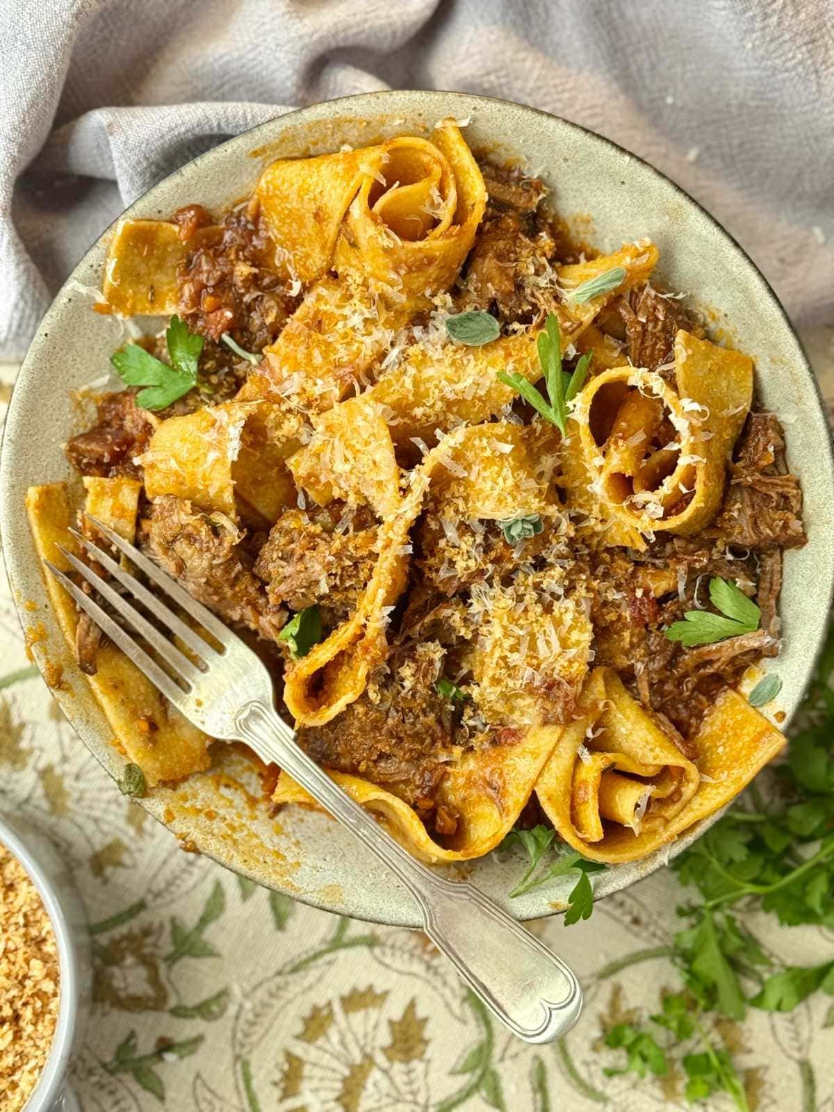 Slow-cooked beef short ribs ragu tossed with pappardelle pasta.