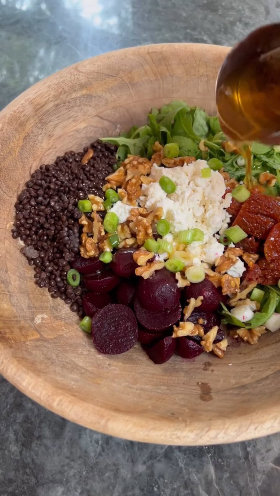 Close-up of beetroot and feta salad with sun-dried tomatoes.