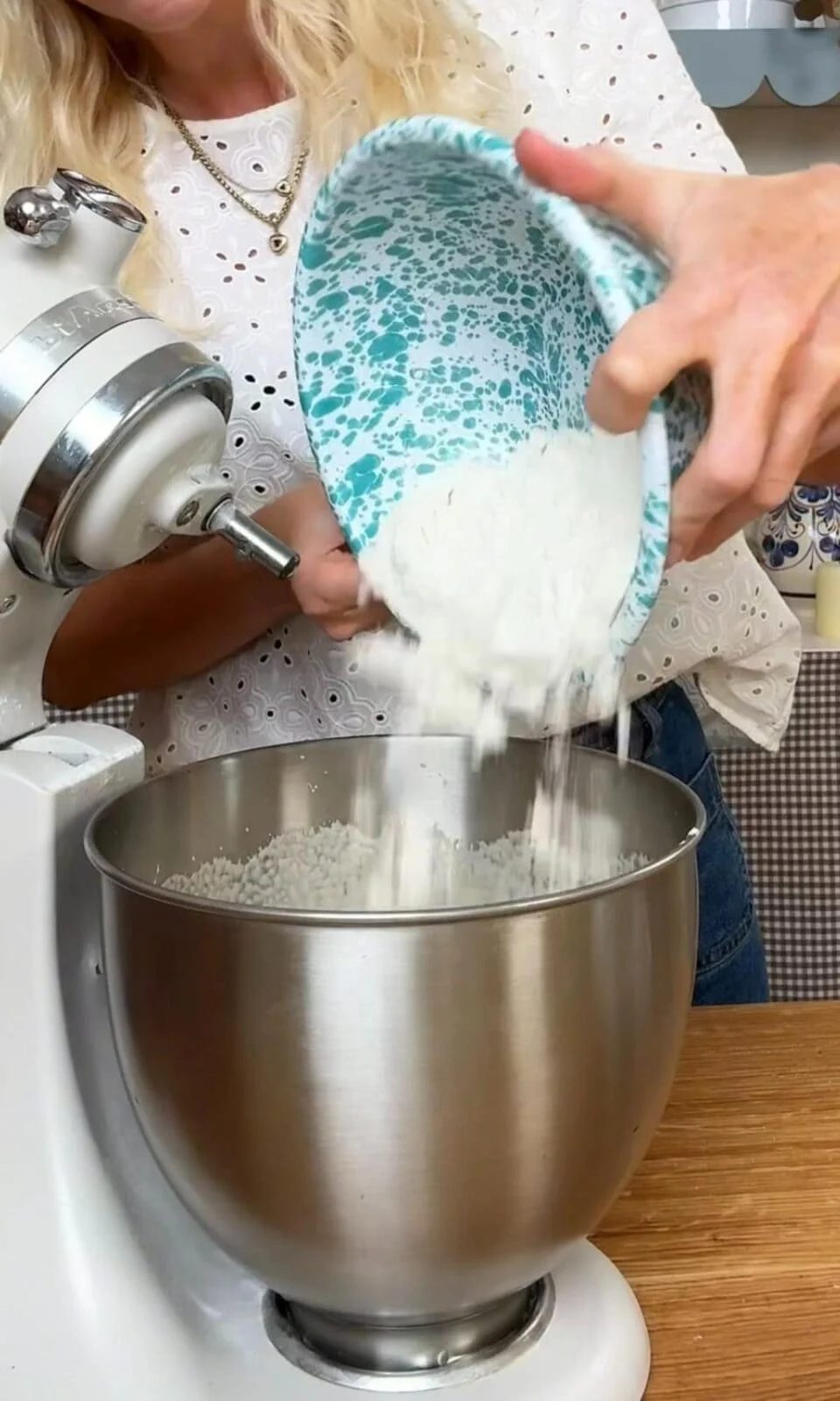 adding flour to berry cake batter.