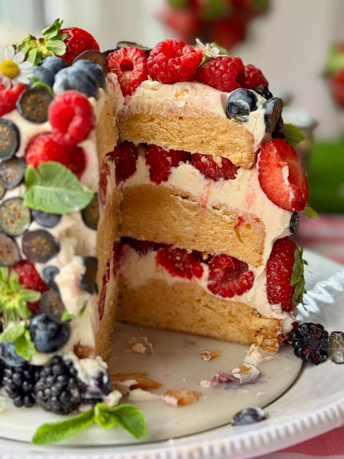 berry cake with slice removed.