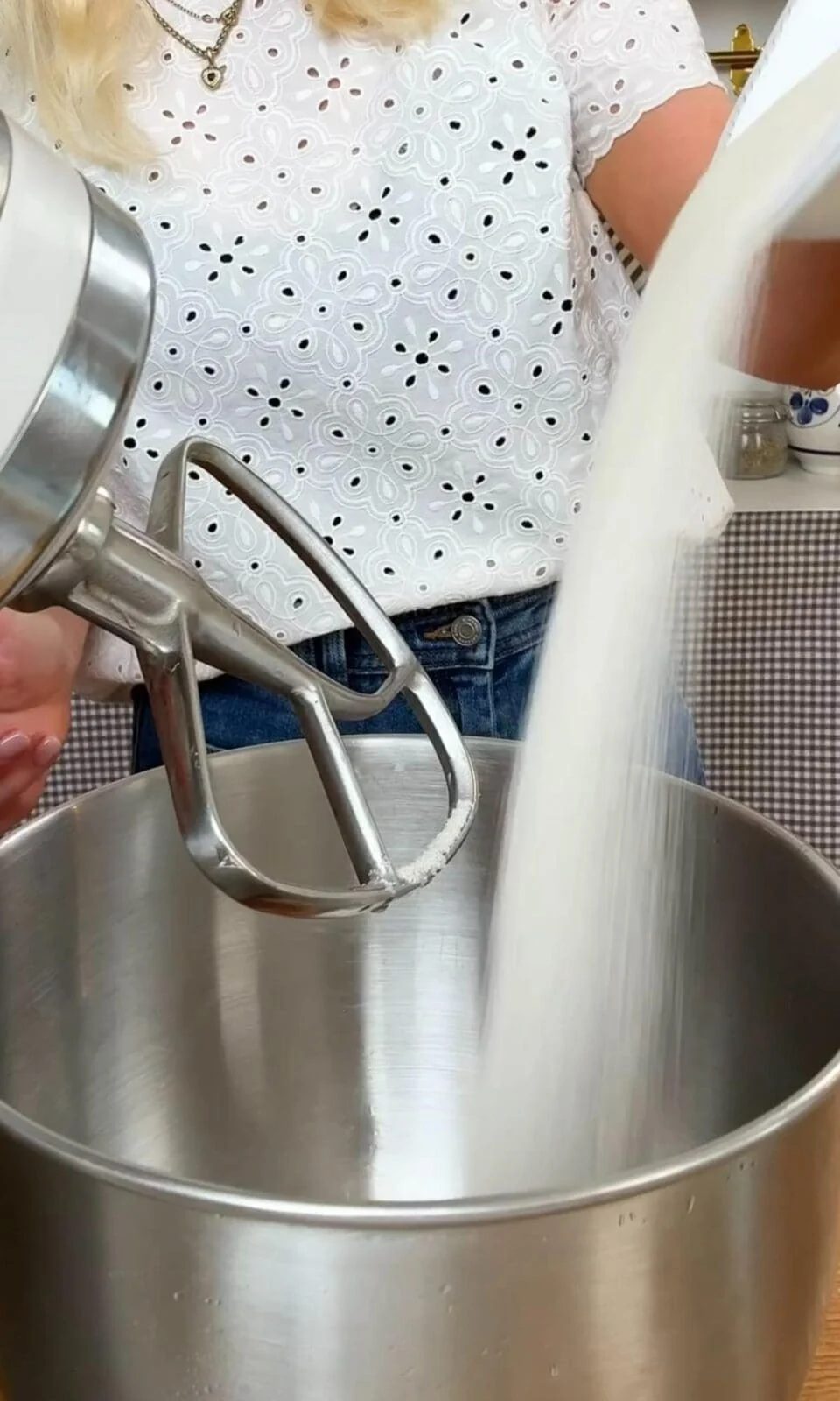 adding sugar to stand mixer.