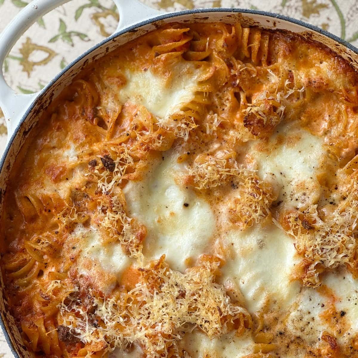 bolognese pasta bake with spoon,