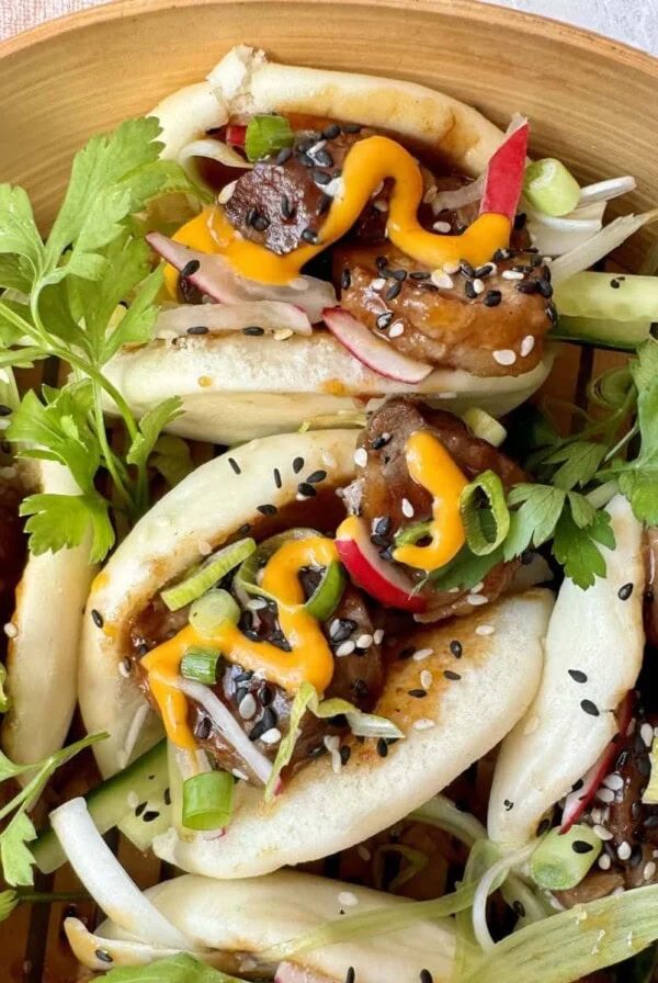 plate of duck bao buns.
