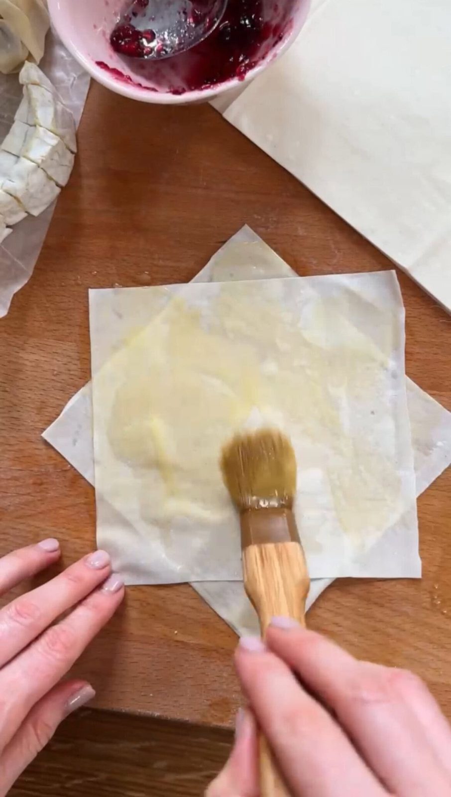Brushing filo with butter.