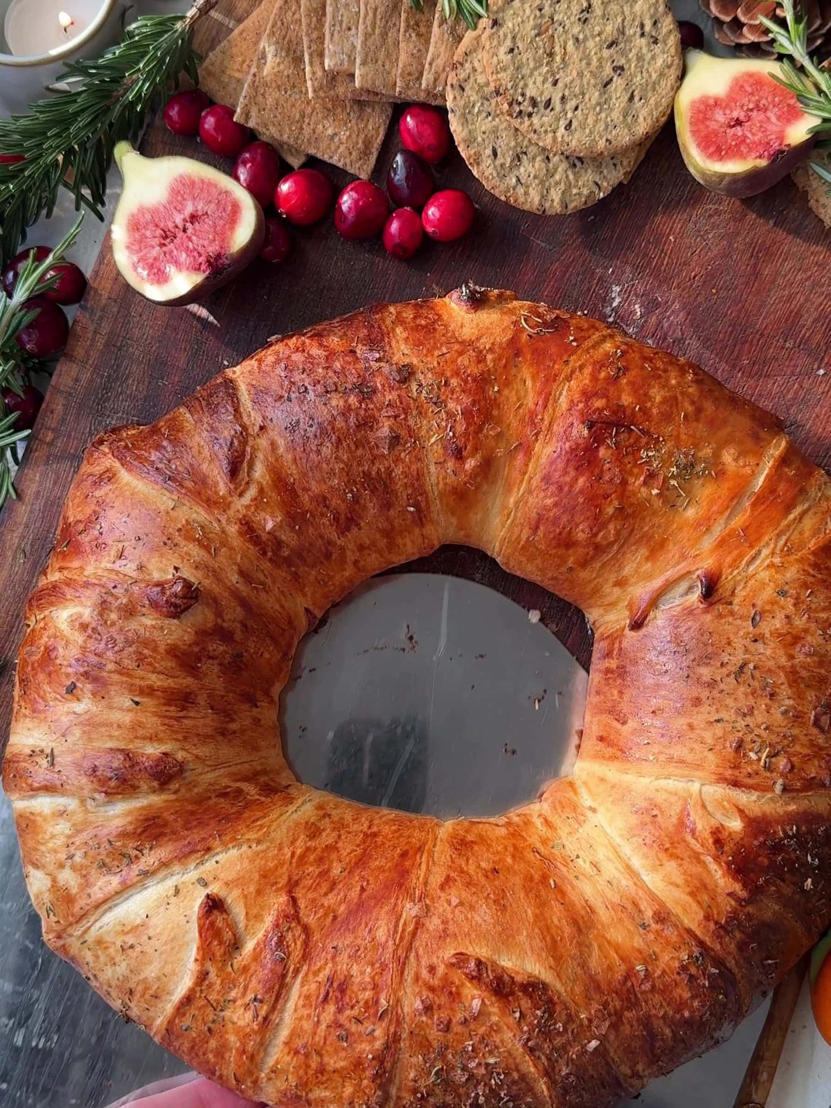 Serving the Brie Crescent Wreath with fresh figs.