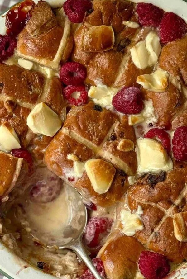 hot cross bun bread and butter pudding with a spoon.