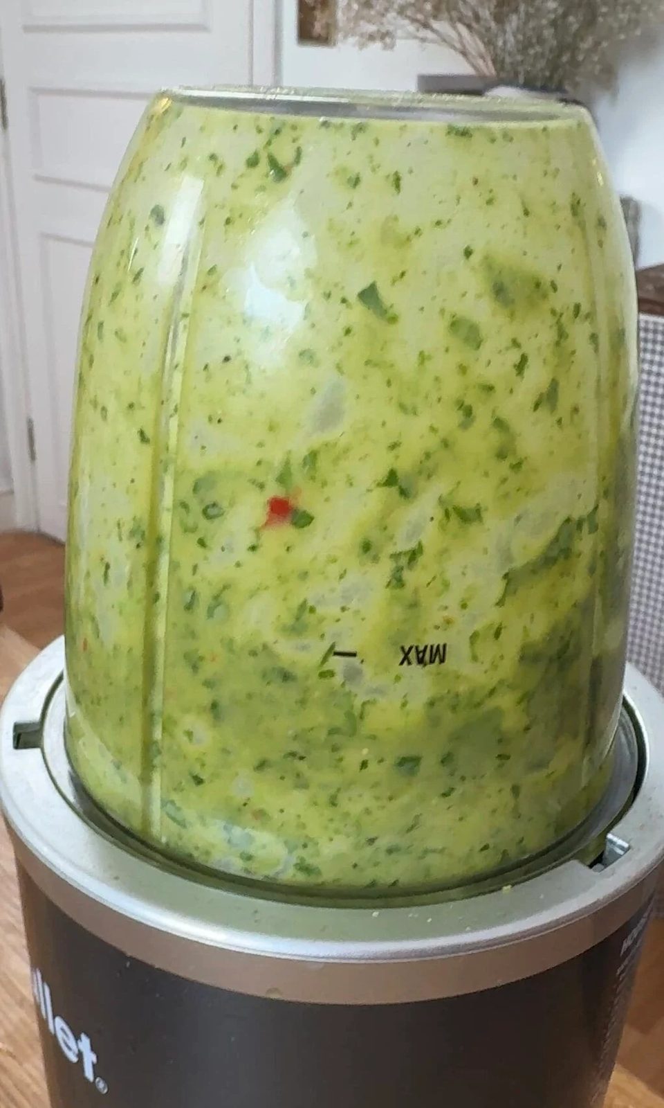 Blending green herby sauce.