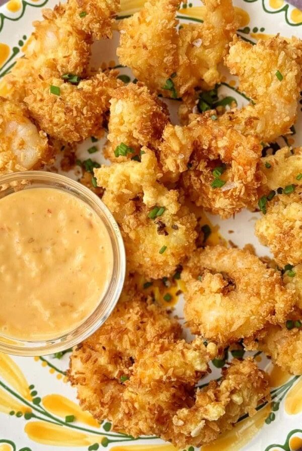 panko shrimp on a plate with dip.