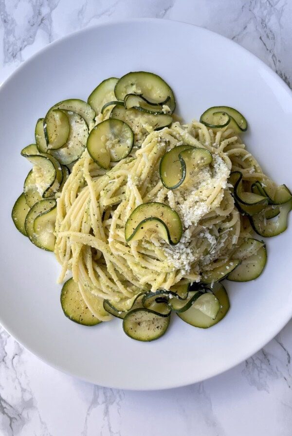 spaghetti alla nerano on a white plate