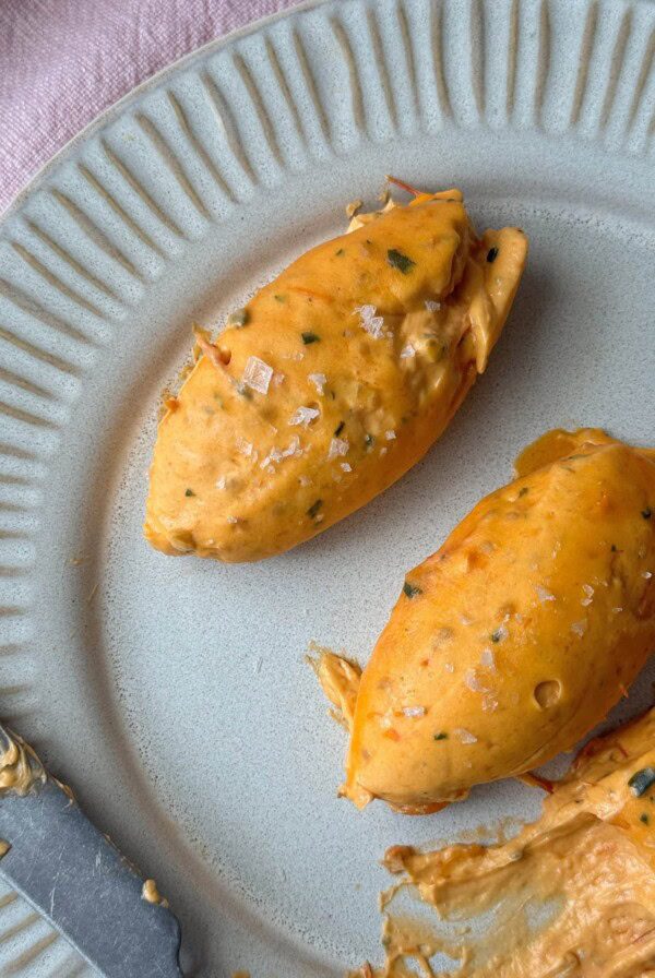 quenelles of tomato butter on a grey plate