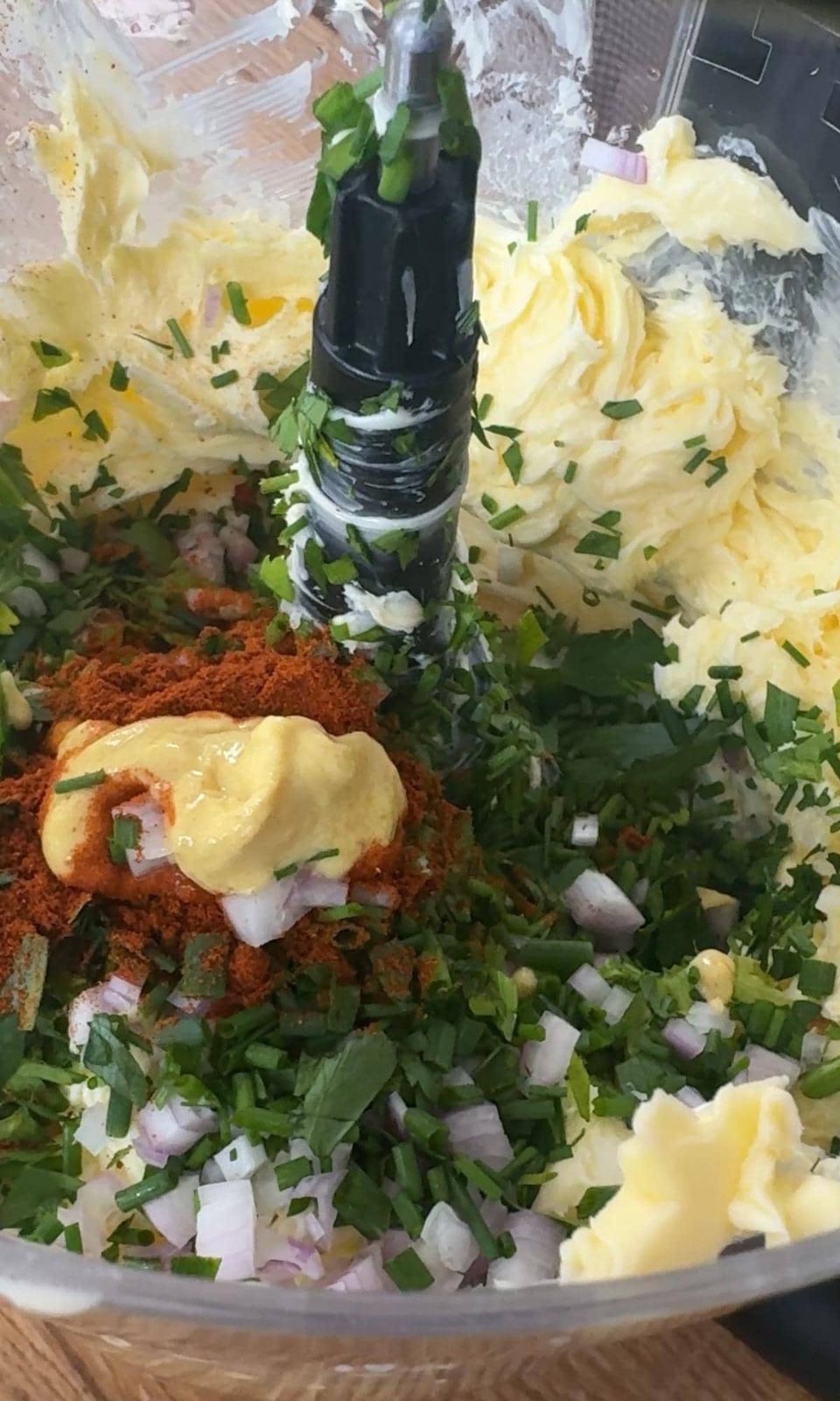 adding ingredients to a blender for cafe de paris butter.