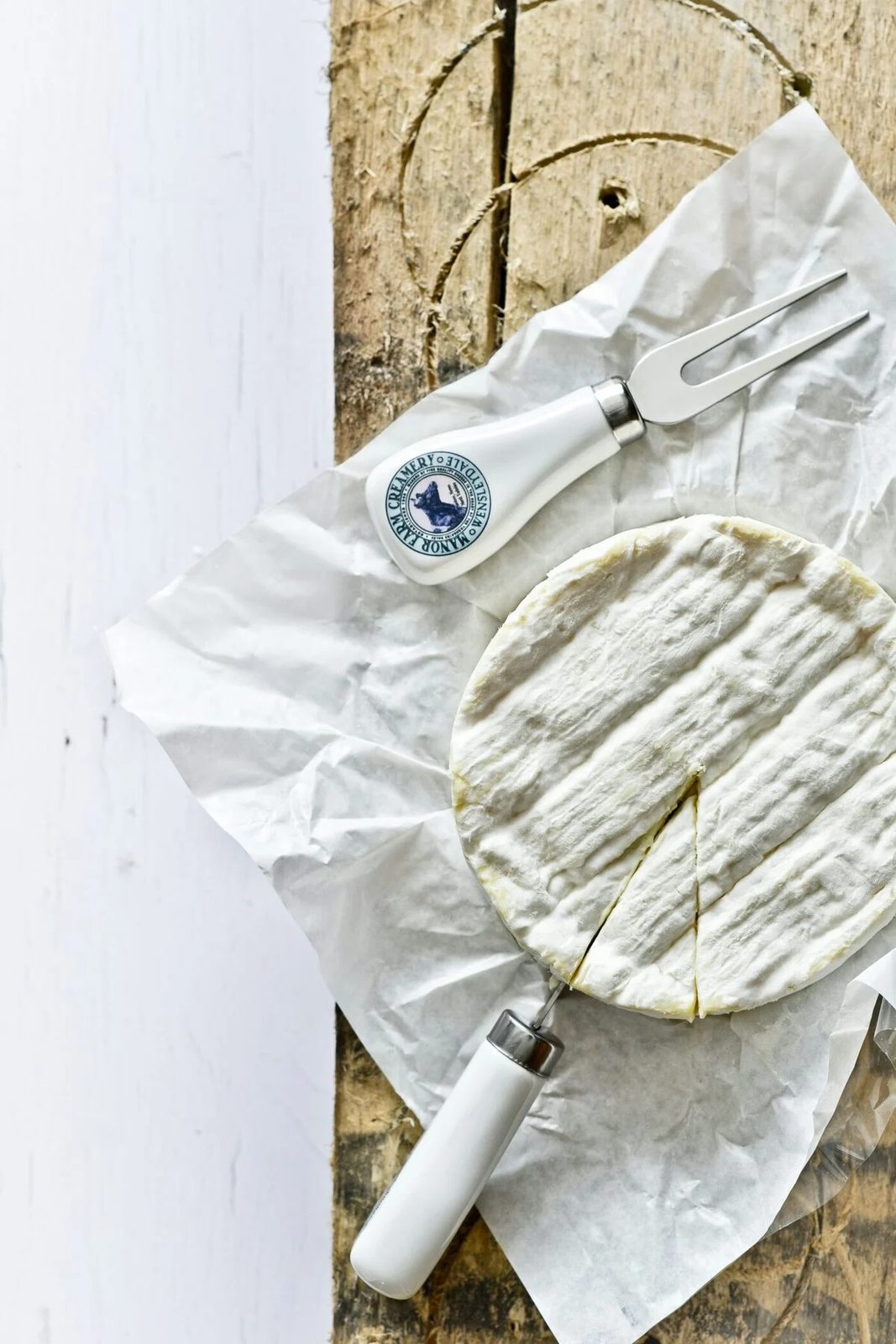 camembert with cheese knife.