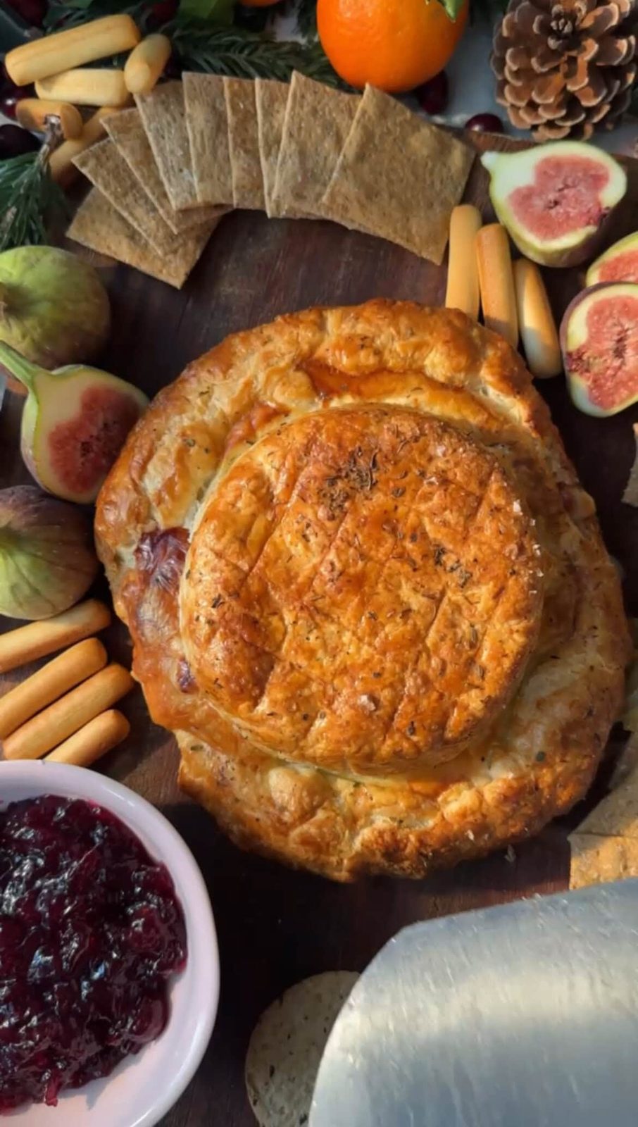 Baked brie en croute on festive table.
