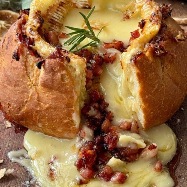 camembert roti in a loaf of bread.