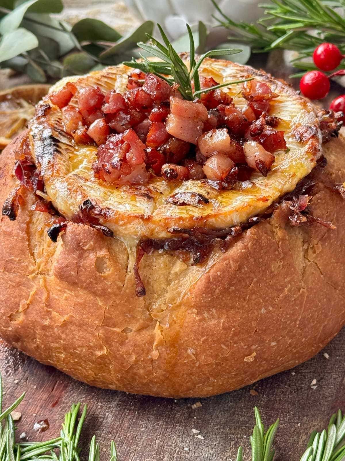 Camembert roti in a loaf of bread.