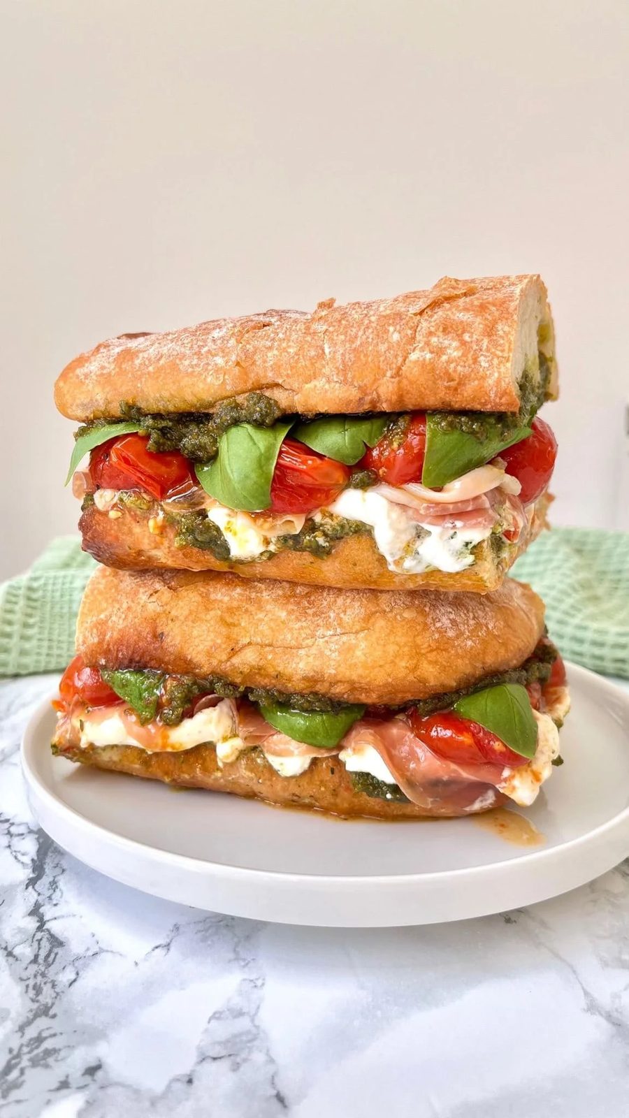 Burrata Caprese Sandwich With Prosciutto And Pistachio Pesto