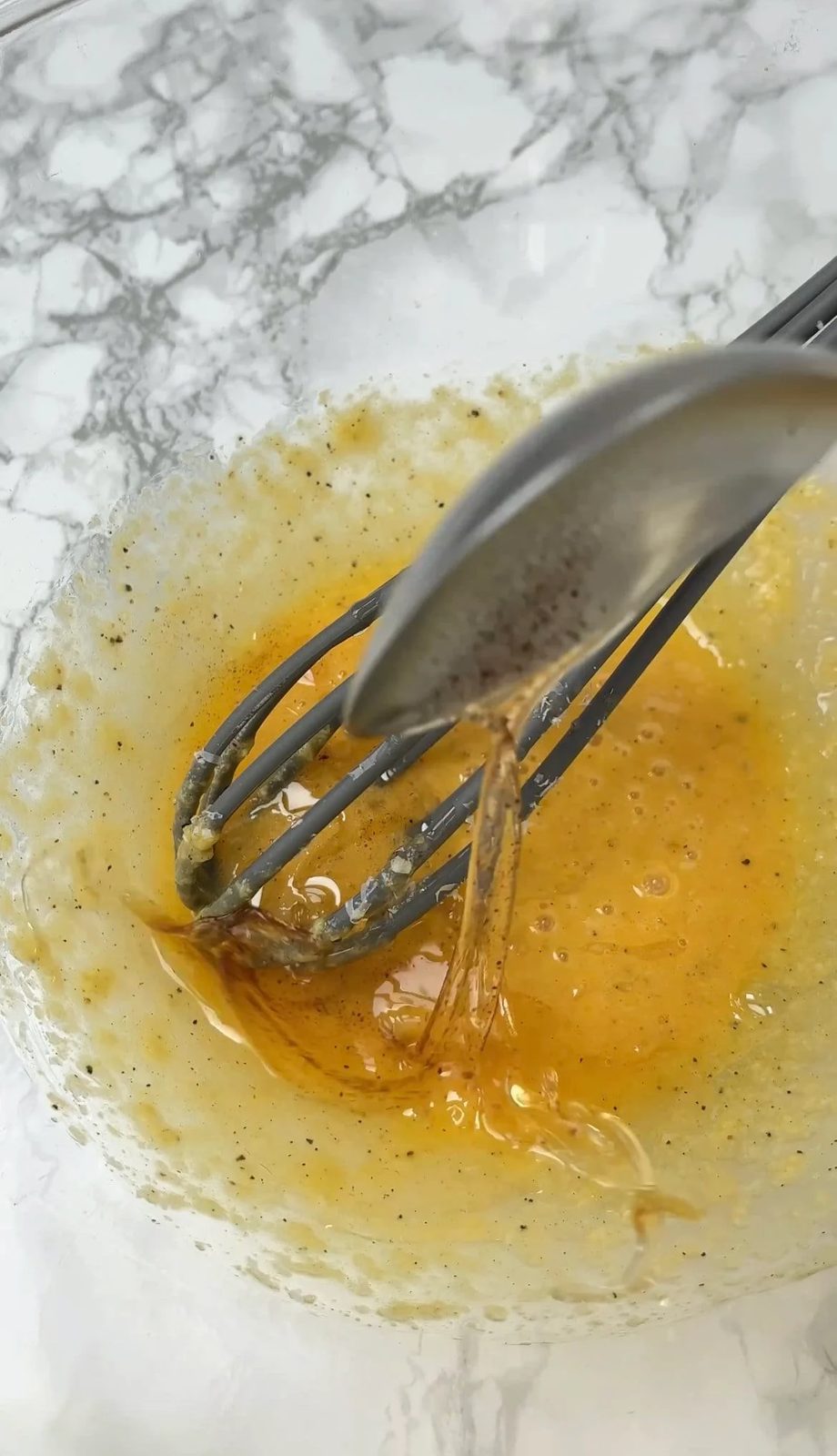 adding guanciale fat to carbonara sauce