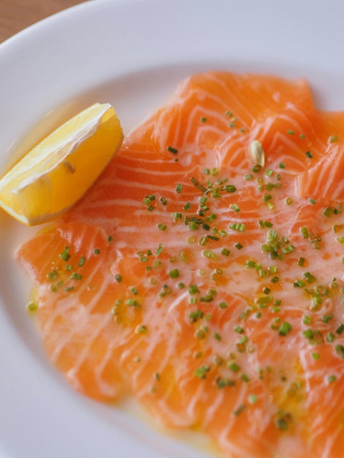 salmon carpaccio with lemon and capers.