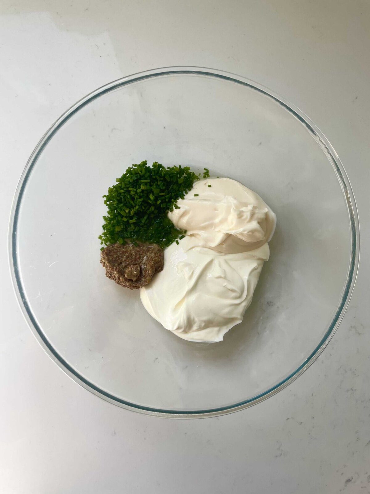 mixing dressing for celeri remoulade.