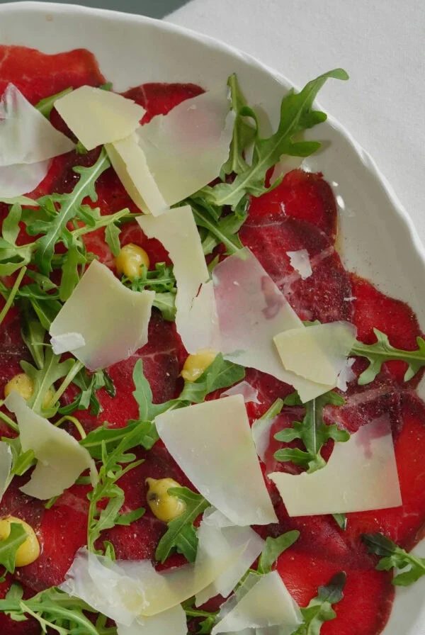 beef carpaccio with arugula and parmesan.
