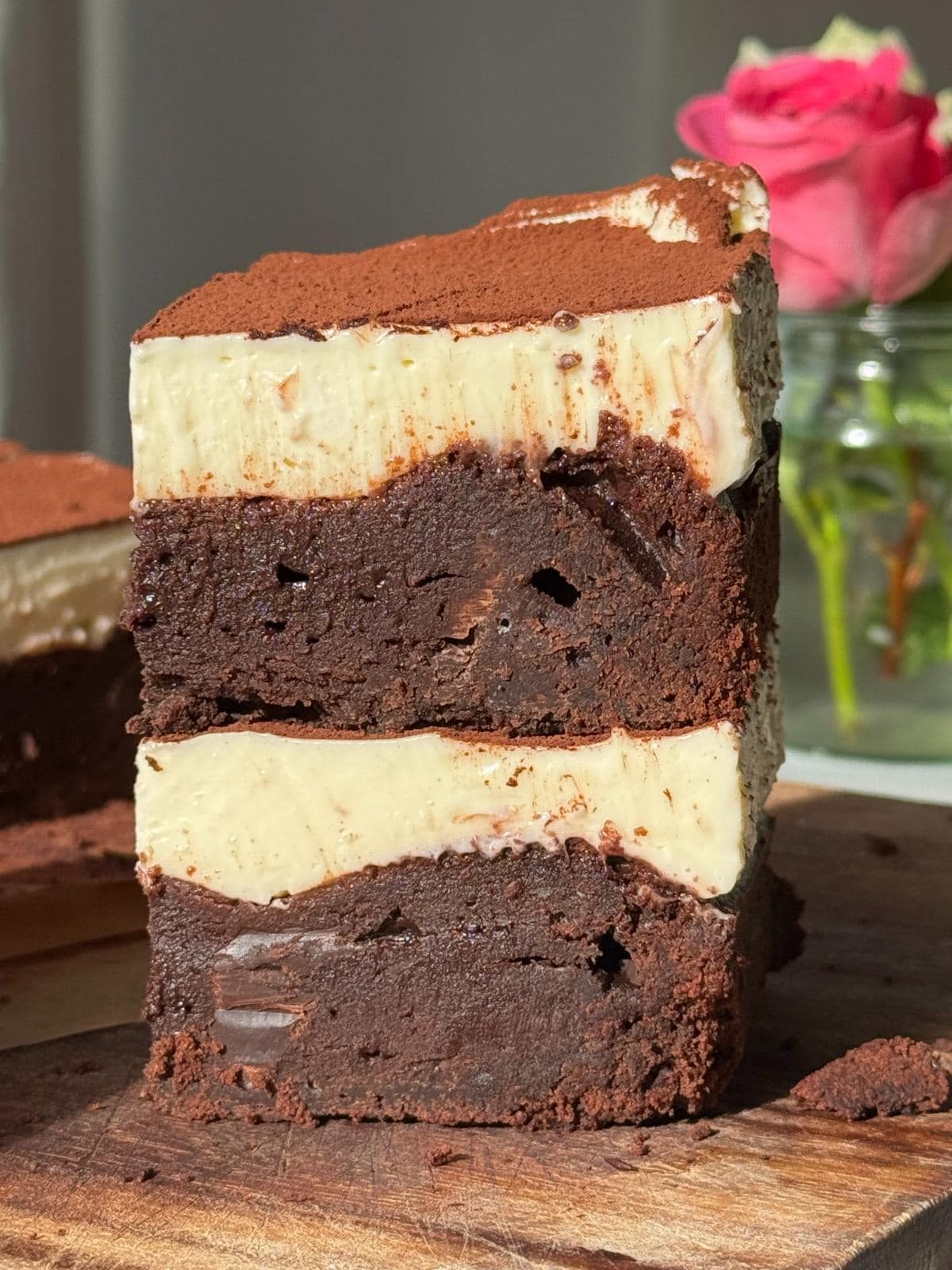 a stack of two cheesecake brownies.