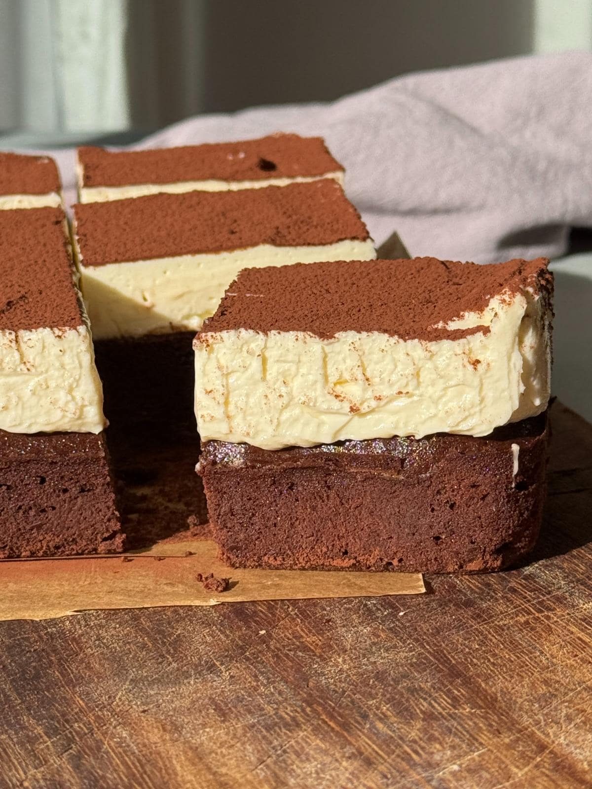one cheesecake brownie sliced.