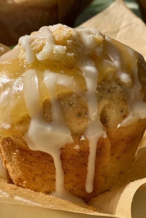 one lemon and poppy seed muffin on baking paper.