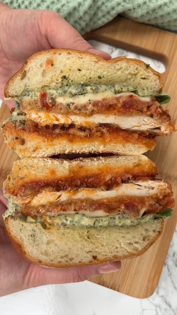 Sliced chicken Parmesan sandwiches.