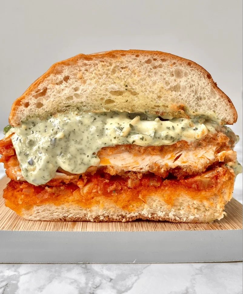 Sliced chicken Parmesan sandwich.