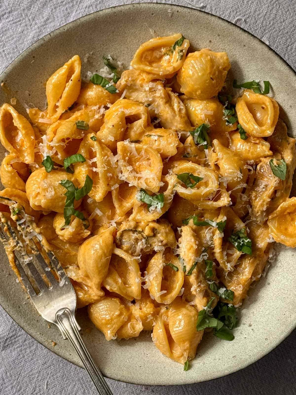 chicken garlic parmesan pasta in grey bowl.