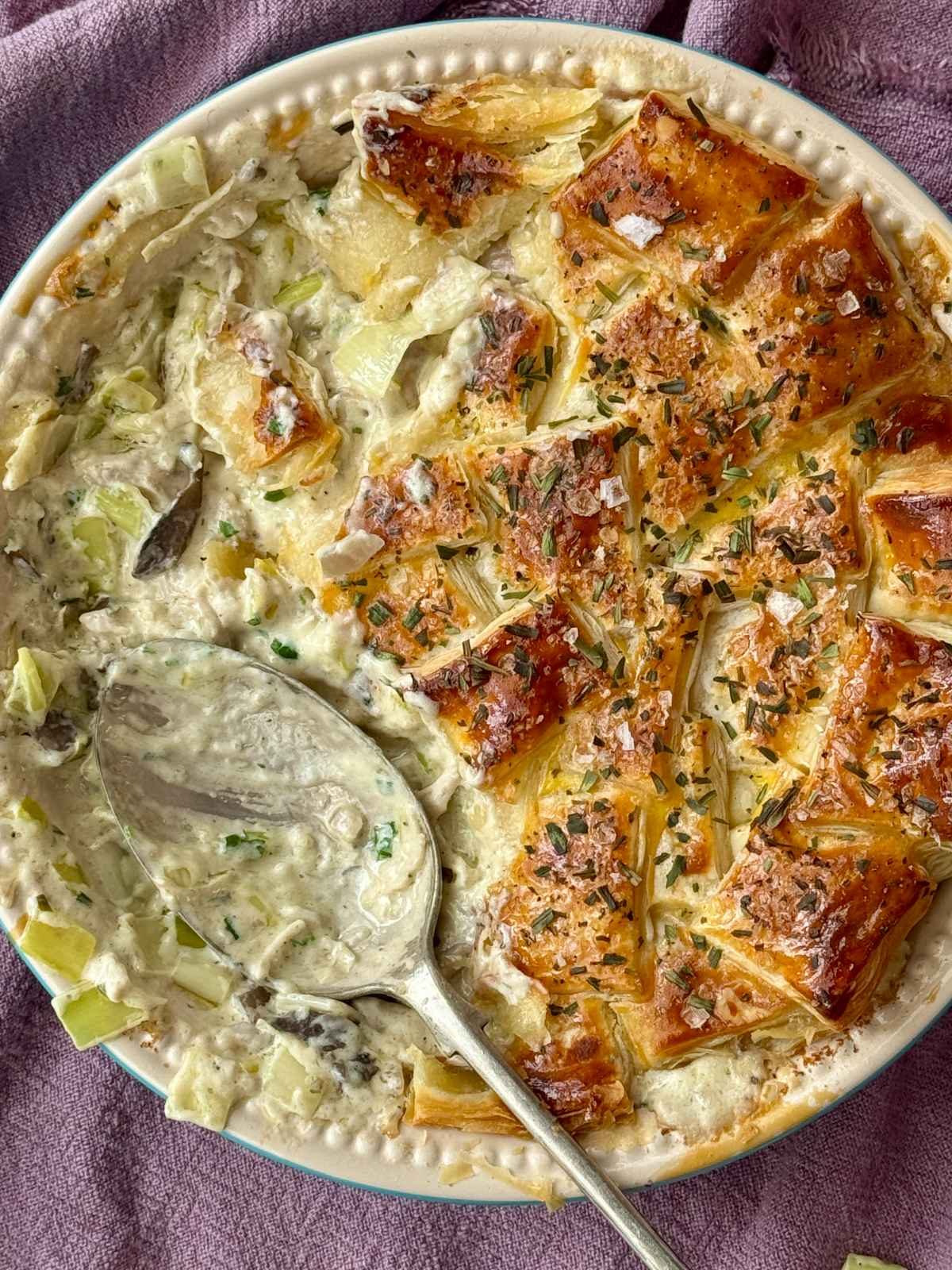 Chicken pie with mushrooms in a pie dish.