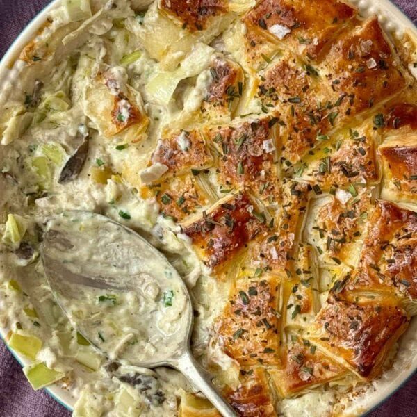 chicken pie with mushrooms in a pie dish.